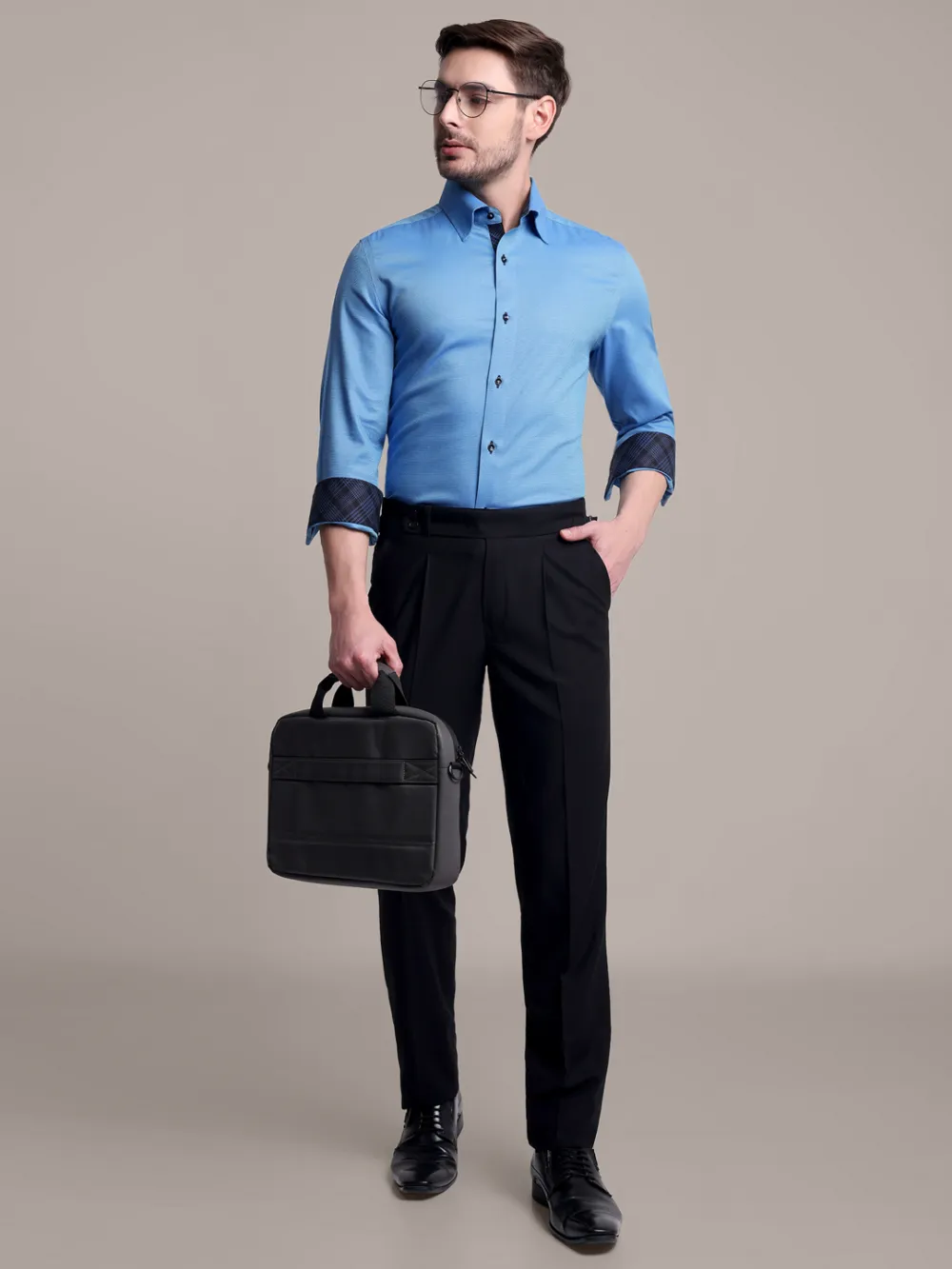 Topaz designer pair of plain turquoise shirt and black trousers